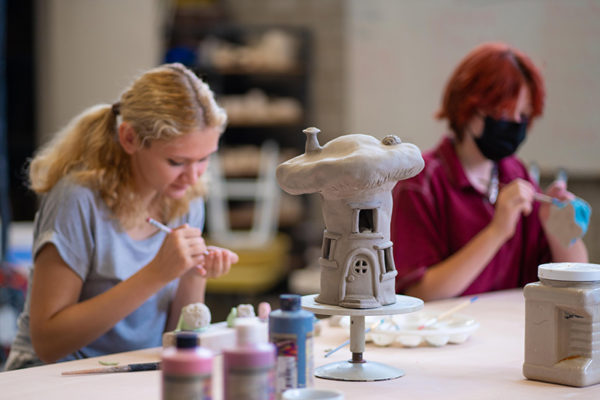 Teens glaze clay sculptures