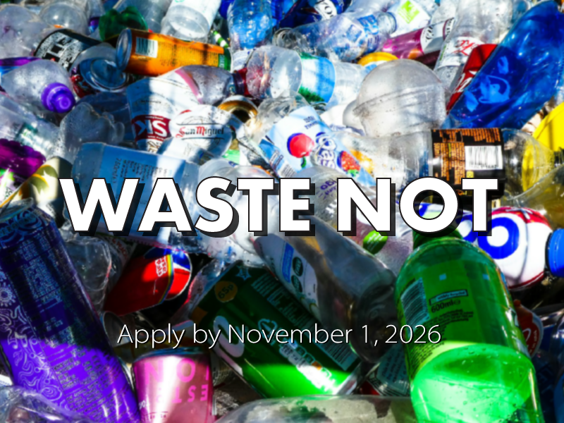 A pile of plastic bottles, ready for recycling, with the text Waste Not superimposed.  