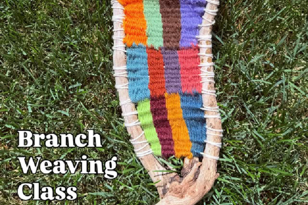 A woven branch laid on top of grass with the text Branch Weaving Class next to it